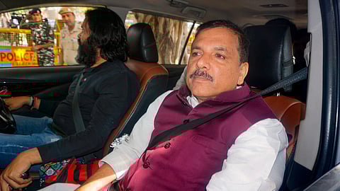 AAP leader Sanjay Singh on his way to appear before a court in the Delhi excise policy case, in New Delhi, Saturday, April 6, 2024.
