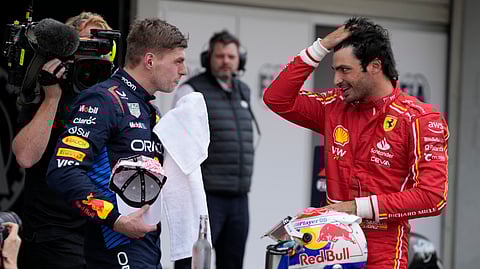 Red Bull driver Max Verstappen of the Netherlands, left, Ferrari driver Carlos Sainz of Spain, right, speak after the Japanese Formula One Grand Prix at the Suzuka Circuit in Suzuka, central Japan, Sunday, April 7, 2024.