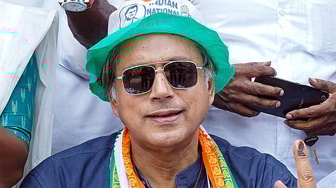 Thiruvananthapuram Congress candidate Shashi Tharoor shows his ink marked finger after casting his vote for the second phase of Lok Sabha elections.