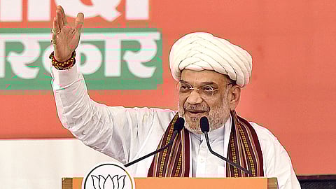 Union Home Minister and BJP leader Amit Shah addresses a public meeting for Lok Sabha elections, in Rajkot district, Gujarat, Saturday, April 27, 2024.
