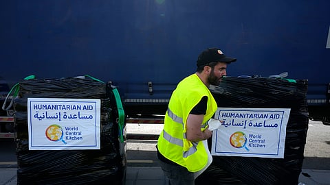 A member of the World Central Kitchen prepares a pallet with the humanitarian aid for transport to the port of Larnaca from where it will be shipped to Gaza, at a warehouse near Larnaca, Cyprus.