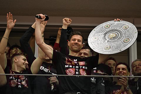 Xabi Alonso celebrates with Bayer Leverkusen players (Photo | AFP)