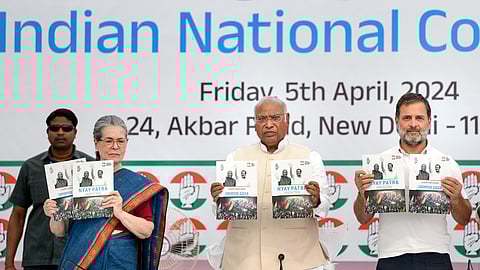 Congress President Mallikarjun Kharge with senior party leaders Sonia Gandhi and Rahul Gandhi releases the party's manifesto ahead of Lok Sabha elections, in New Delhi, Friday, April 5, 2024