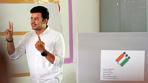 Bengaluru South constituency BJP candidate Tejasvi Surya shows his finger marked with indelible ink after casting his vote for the 2nd phase of Lok Sabha elections, in Bengaluru, Friday, April 26, 2024.