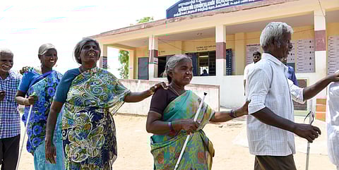 Disabled persons leaving the polling booth at Nagamangalam near Tiruchy after casting vote on Friday