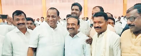 BRS leader Ch Malla Reddy poses with BJP candidate Eatala Rajender on Friday