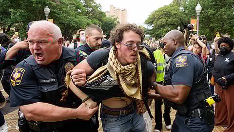 University of Texas police officers arrest a man at a pro-Palestinian protest on campus, Wednesday April 24, 2024, in Austin, Texas.