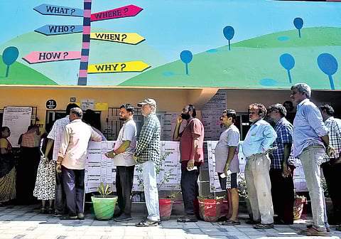 People queue up to vote at a polling booth at Kolathur, Chennai. (Photo | P Ravikumar, EPS)