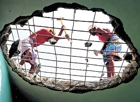 Construction labourers at work.