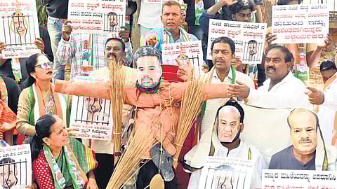 Congress workers hold demonstrations against JDS Hassan Lok Sabha candidate Prajwal Revanna in Bengaluru on Sunday