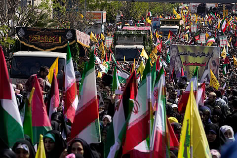 Trucks carry the coffins of Revolutionary Guard members killed in an Israeli airstrike that destroyed Iran's Consulate in Syria.