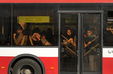 Passengers use a BRT bus in downtown Tehran, Iran, Sunday, April 14, 2024.