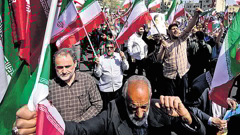 Worshippers chant slogans during an anti-Israeli gathering after Friday prayers in Tehran, Iran, on April 19.