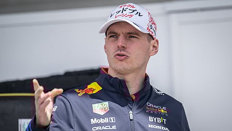 Red Bull Racing's driver Max Verstappen gestures in the paddock ahead of the Formula One Japanese Grand Prix at the Suzuka circuit in Suzuka, Mie prefecture on April 4, 2024.