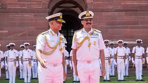 Admiral Dinesh Kumar Tripathi (R) with outgoing Navy Chief Adm R. Hari Kumar during a guard of honour ceremony before assuming charge as the 26th Navy chief in New Delhi.