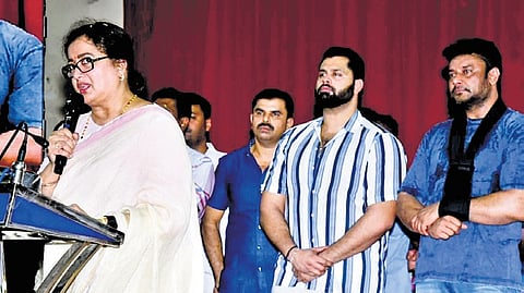 Mandya MP Sumalatha Ambareesh addresses her supporters, as her son Abishek Ambareesh and Kannada superstar Darshan look on, in Mandya on Wednesday