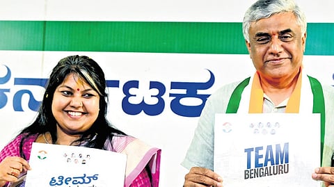 Congress candidates for Bangalore South Sowmya Reddy and North Rajeev Gowda release the party manifesto in Bengaluru on Wednesday