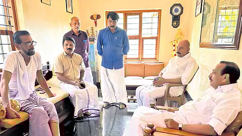 UDF candidate M K Raghavan interacting with Shyamnath’s father Vishwanathan at their residence in Velliparamba, Kozhikode, on Monday.
