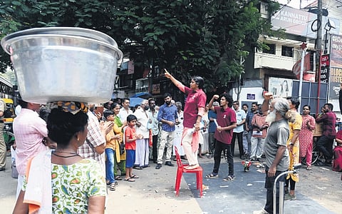 Party workers stage a street play in Thiruvananthapuram