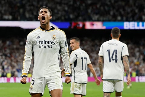 Real Madrid's Jude Bellingham celebrates scoring his team's third goal during the Spanish league football match between Real Madrid CF and FC Barcelona at the Santiago Bernabeu stadium in Madrid on April 21, 2024.
