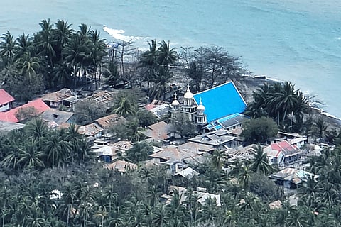 This photo provided by the Indonesian National Search and Rescue Agency (BASARNAS) shows a part of a village on Tagulandang island covered by ash from eruptions of Mountt Ruang.