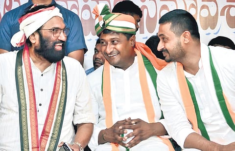 Irrigation Minister N Uttam Kumar Reddy speaks to Congress Nalgonda candidate
K Raghuveer Reddy during a meeting in Devarkonda on Saturday.