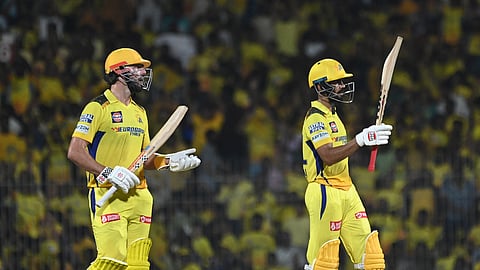 Chennai Super Kings skipper Ruturaj Gaikwad celebrates his half century as team-mate Darryl Mitchell looks on during the 2024 IPL T20 match against Sunrisers Hyderabad at the MA Chidambaram stadium in Chennai on Sunday.
