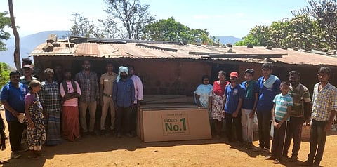 Volunteers installing new modern solar panel lights in the Kathirimalai tribal village in 2024.