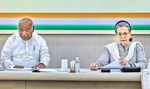 Congress president Mallikarjun Kharge with party leader Sonia Gandhi during the Central Election Committee meeting in New Delhi on Sunday.