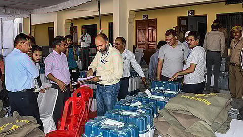 Polling parties leave for election duty after collecting EVMs and other election material ahead of Lok Sabha polls, in Nanital, Wednesday, April 17, 2024.