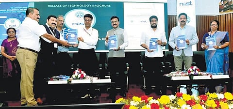 Dr M Srinivas, director, AIIMS, New Delhi, handing over the technology brochure to Dr Joshy Varkey, MD, Bio Vastum Solutions, at the conclave