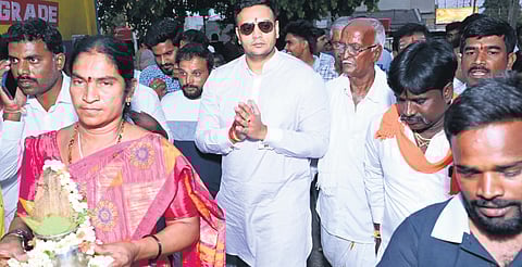 BJP candidate Yaduveer takes part in a religious event at Jayapura village in Mysuru