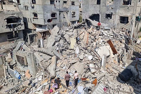 Palestinians look at the destruction after an Israeli airstrike in Rafah, Gaza Strip. Monday, April 29, 2024.