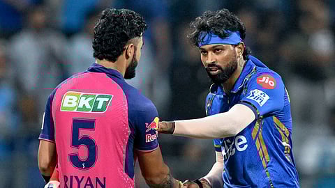 Mumbai Indians' captain Hardik Pandya greets Rajasthan Royals' Riyan Parag (L) at the end of the IPL Twenty20 cricket match between Mumbai Indians and Rajasthan Royals on April 1, 2024.