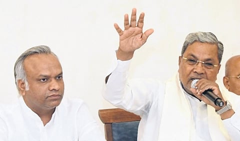 Karnataka CM Siddaramaiah (R) and Minister Priyank Kharge.