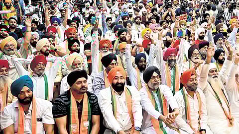 BJP supporters during joining of the party by some new leaders, at the party headquarters, in New Delhi