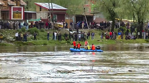 Rescue operation underway after a boat capsized in the Jhelum river, on the outskirts of Srinagar.