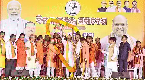 Union Home Minister Amit Shah being greeted with a huge garland by BJP workers during the public meeting at Sonepur on Thursday