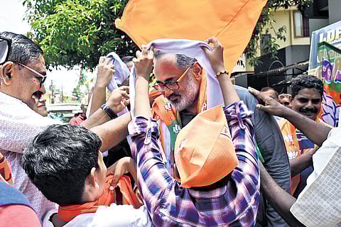 BJP workers welcome Rajeev Chandrasekhar with shawls at Aksharaveedhi Nagar
in Pettah.