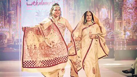 Odissi dancer Saswat Joshi and Jagruti Rath walk the ramp as showstoppers during the fashion show on theme Ramayan by designer Amrita Sabat at the 10th season of Bhubanesswar Runway Week in Bhubaneswar on Sunday
