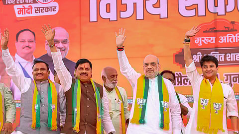 Union Home Minister and BJP leader Amit Shah with Union Minister Jyotiraditya Scindia and Madhya Pradesh Chief Minister Mohan Yadav during a public meeting for Lok Sabha elections, in Ashoknagar district, Madhya Pradesh, Friday, April 26, 2024.