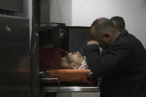 A Palestinian killed in a settler rampage lies in the morgue at the Palestine Medical Complex in the West Bank city of Ramallah, Friday, April 12, 2024.