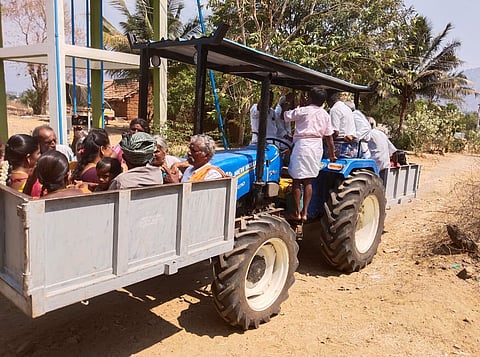 A picture of tribal voters being transported to the polling station in Erimalai to cast their votes.
