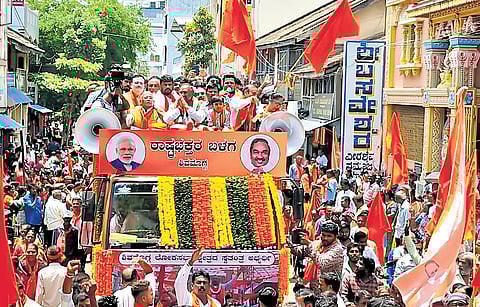 Independent candidate K S Eshwarappa arrives in a procession to file his nomination papers in Shivamogga on Friday