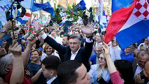 Croatia's Prime Minister and President of Croatian Democratic Union (HDZ) party, Andrej Plenkovic (C) meets with supporters as he arrive for a rally in Zagreb.