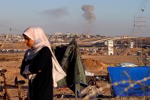 Smoke rises following an Israeli airstrike on buildings near the separating wall between Egypt and Rafah, southern Gaza Strip, Monday, May 6, 2024.