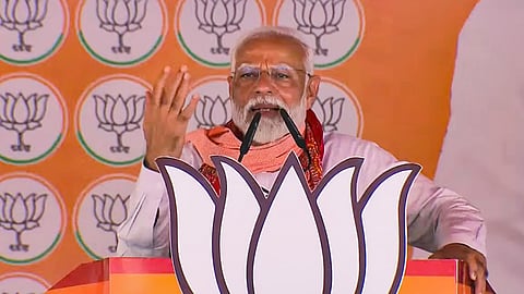 Prime Minister Narendra Modi addresses a poll rally for Lok Sabha elections in Lalganj in Azamgarh