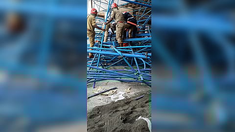 Fire and Rescue personnel searching the wreakage