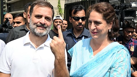 Congress leaders Rahul Gandhi and Priyanka Gandhi show their inked fingers after casting their votes during the sixth phase of Lok Sabha elections