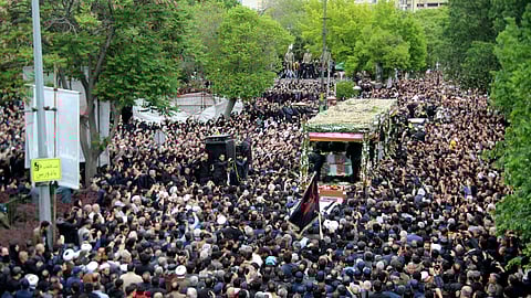 Mourners gather around a truck carrying the coffins of Iranian President Ebrahim Raisi and his companions, who were killed in a helicopter crash on Sunday in a mountainous region of the country's northwest, during a funeral ceremony in the city of Tabriz, Iran, on Tuesday, May 21, 2024.